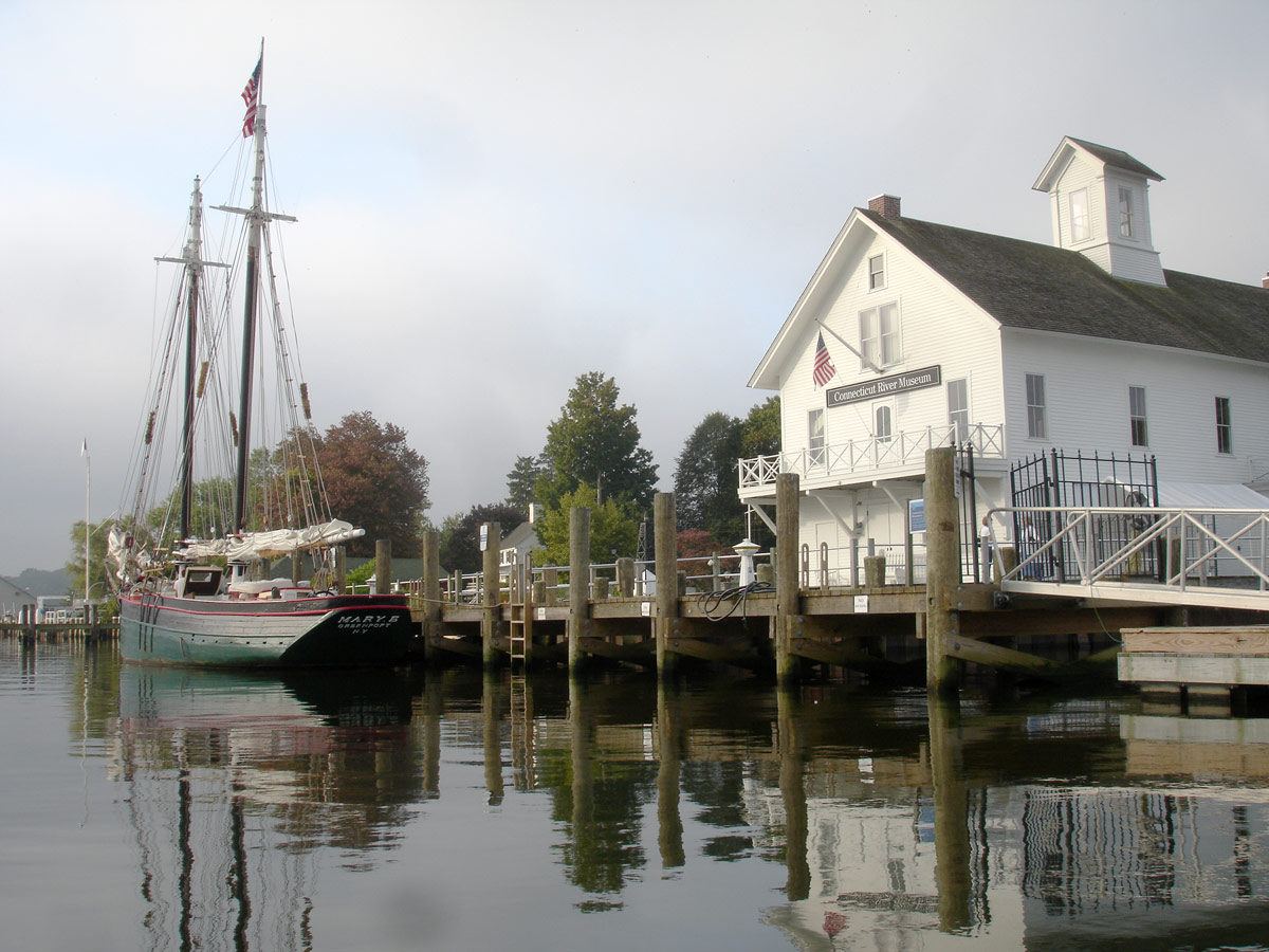 dockside next to replica of an history vessel